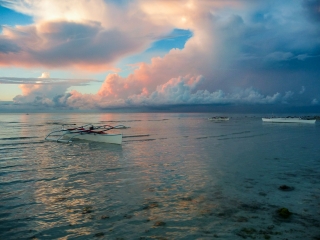 Banka-boats-at-sunrise-Anda-beach-Bohol-Philippines