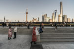 Boy-jumping-off-wall-The-Bund-Shanghai-China