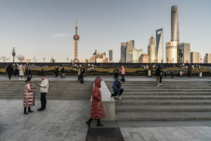 Boy-jumping-off-wall-The-Bund-Shanghai-China