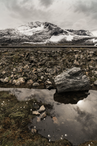 Clouds-refelecting-in-ice-Jotunheimen-Norway
