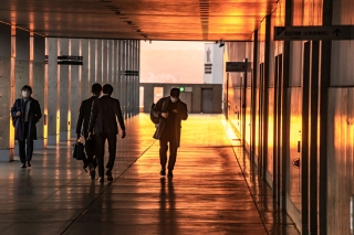 Commuters-bathed-in-late-afternoon-light-Kyoto-Railway-Station-Japan