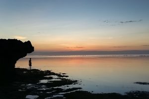 Figure-in-the-shallows-at-dusk--Doljo-beach-Visayas-Philippines