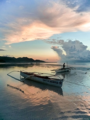Fisherman-and-bankas-1-at-sunrise-Anda-beach-Bohol-Philippines