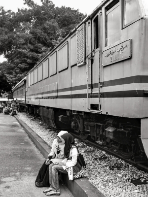 Girls-sat-beside-train-Malacca-Malaysia