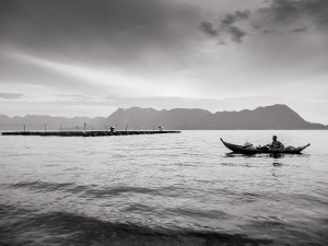 Man-in-traditional-canoe-Lake-Maninjau-Indonesia