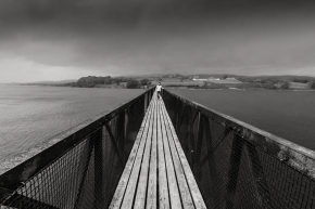 Narrow-footbridge-over-Lyn-Trawsfynydd-reservoir-Gwynedd-Snowdonia-North-Wales