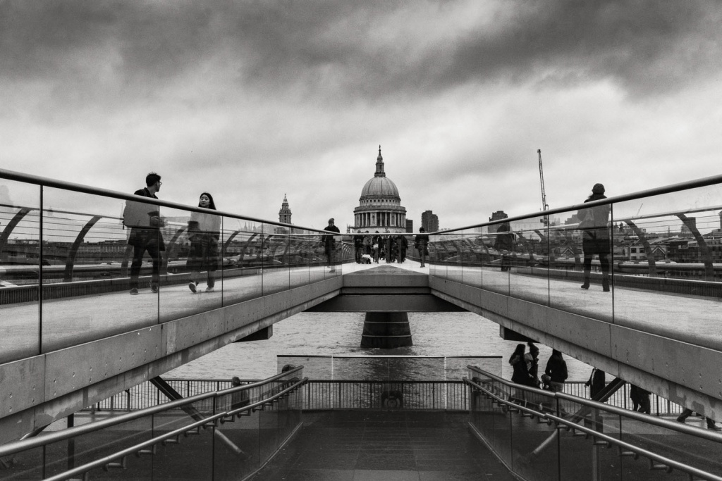 People-on-Millenium-bridge-with-St.Pauls-Cathedral-in-distance-London-England