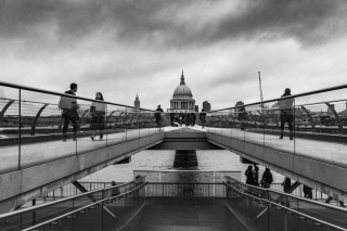 People-on-Millenium-bridge-with-St.Pauls-Cathedral-in-distance-London-England