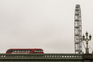 Red-double-decker-bus-on-Westminster-bridge-and-London-Eye-England
