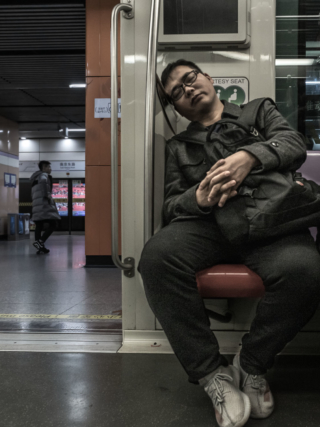 Sleeping-man-on-the-Metro-Shanghai-China