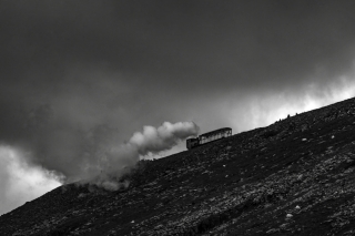 Steam-train-approaching-summit-of-Mount-Snowdon