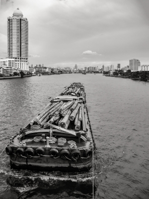 Timber-being-transported-on-Chao-Phraya-River-Bangkok-Thailand