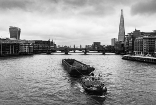 Tug-boat-on-River-Thames-with-Tower-Bridge-and-Shard-London-England