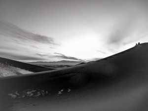 Two-figures-on-top-of-sand-dunes-of-the-Gobi-Desert-Mongolia