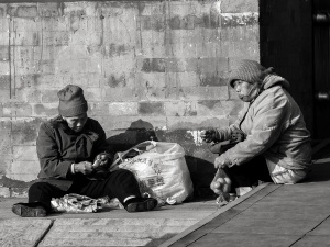 Two-women-sat-on-the-ground-eating-Forbidden-City-Beijing-China