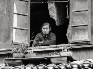 Woman-in-window-Yangshuo-China