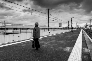 Woman-on-platform-waiting-for-train-Kyoto-Japan