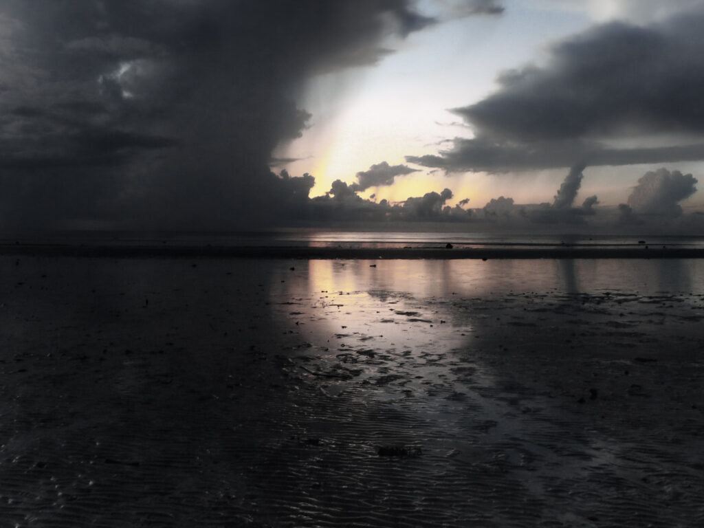 Storm clouds at sunrise Anda beach Bohol Philippines