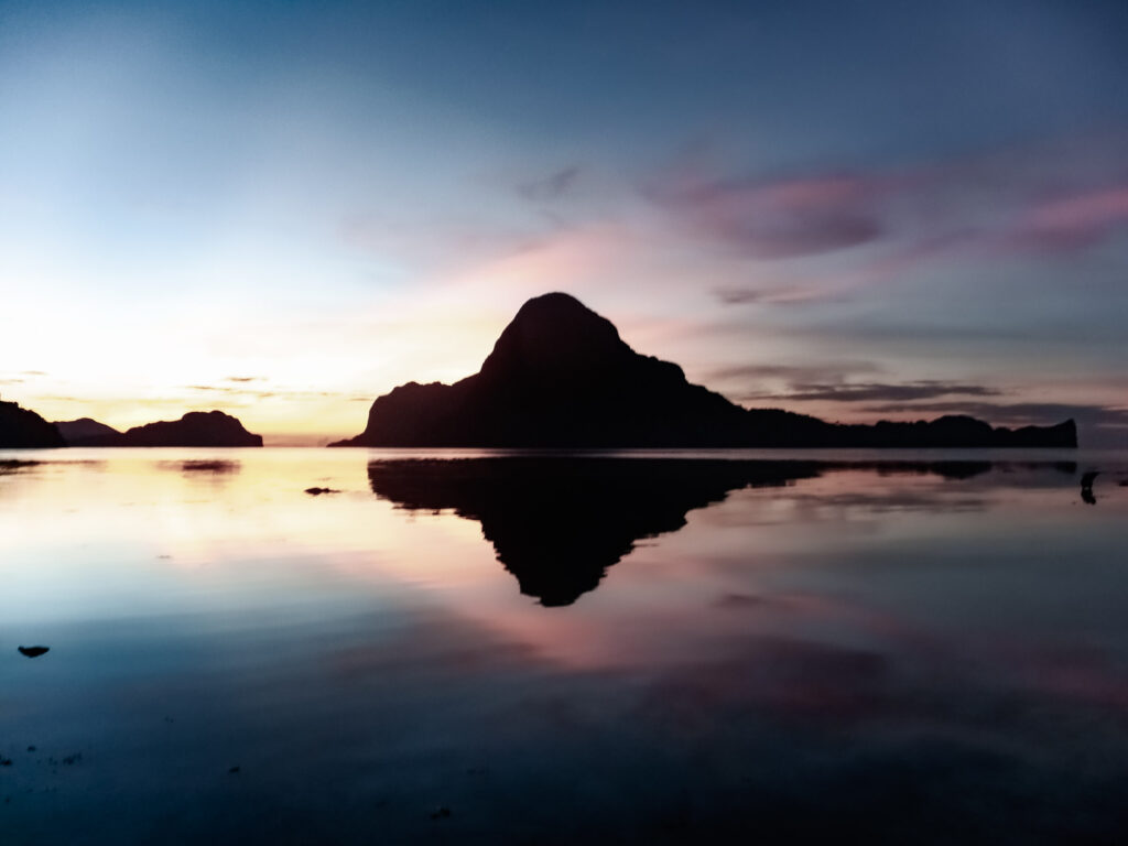 Sunsetting behind Islands surrounding El Nido Palawan Philippines