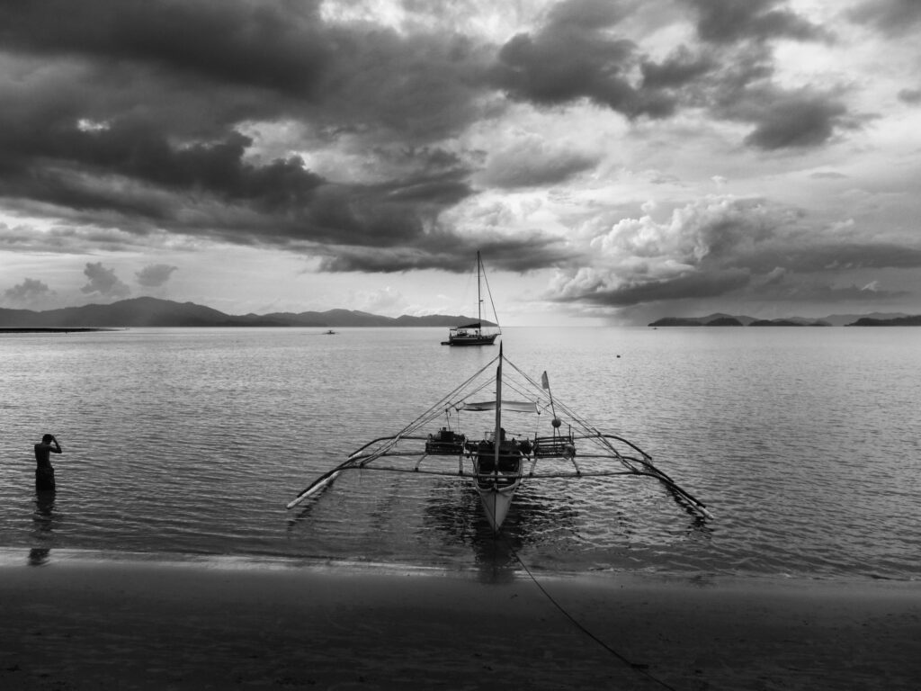 Man and Bangka Port Barton Palawan Philippines